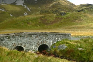 Road from Falcarragh SE to R251 - Bridge of Tears I only know this bridge as the Bridge of Tears. This is the spot where emmigrants continued onward across the bridge and up the hill to the right, as the start of a very long walk to get to the ships that would take them to America and/or Canada, and where their family members remaining in Ireland would part with them and return to their homes. The Gweedore area of Donegal was hard hit by the famine and home evictions. © Copyright Joseph Mischyshyn and licensed for reuse under this Creative Commons Licence.