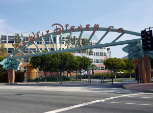 Entrance arch at the north entrance to the Walt Disney Studios, home of the headquarters of the Walt Disney Company, on Alameda Avenue in Burbank, California. The Frank Wells Building is visible in the background on the left. (replacing an earlier photo also taken by Coolcaesar at same location on April 24, 2005). Author: CoolCaesar